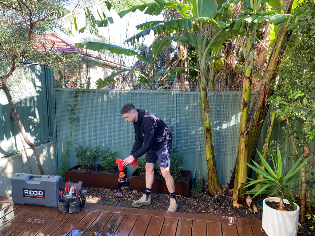 RaeCo Plumber Digging the Spot of Blocked Drain Pipe